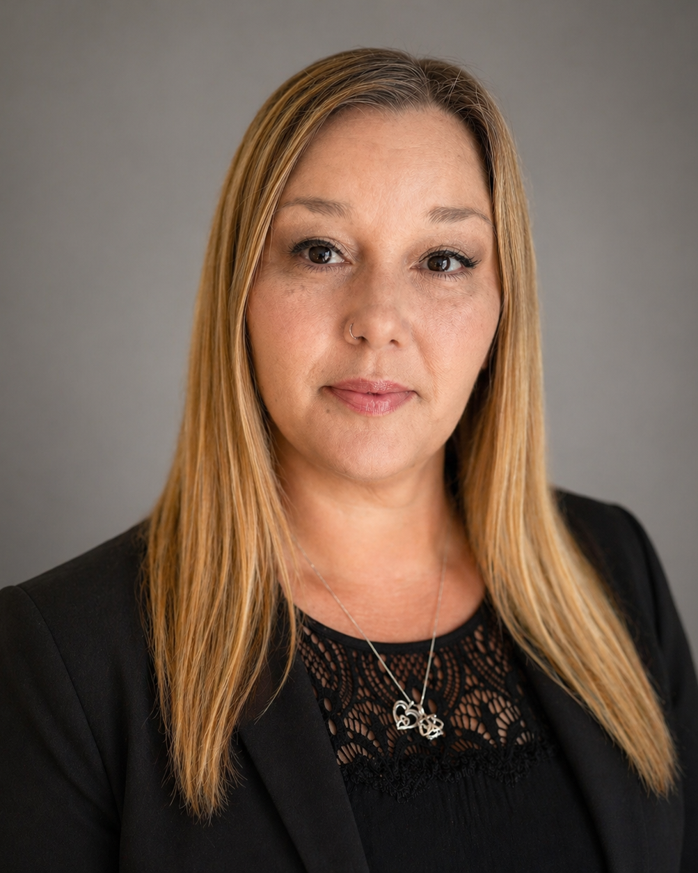 Debra Vidal wearing a black shirt and black jacket